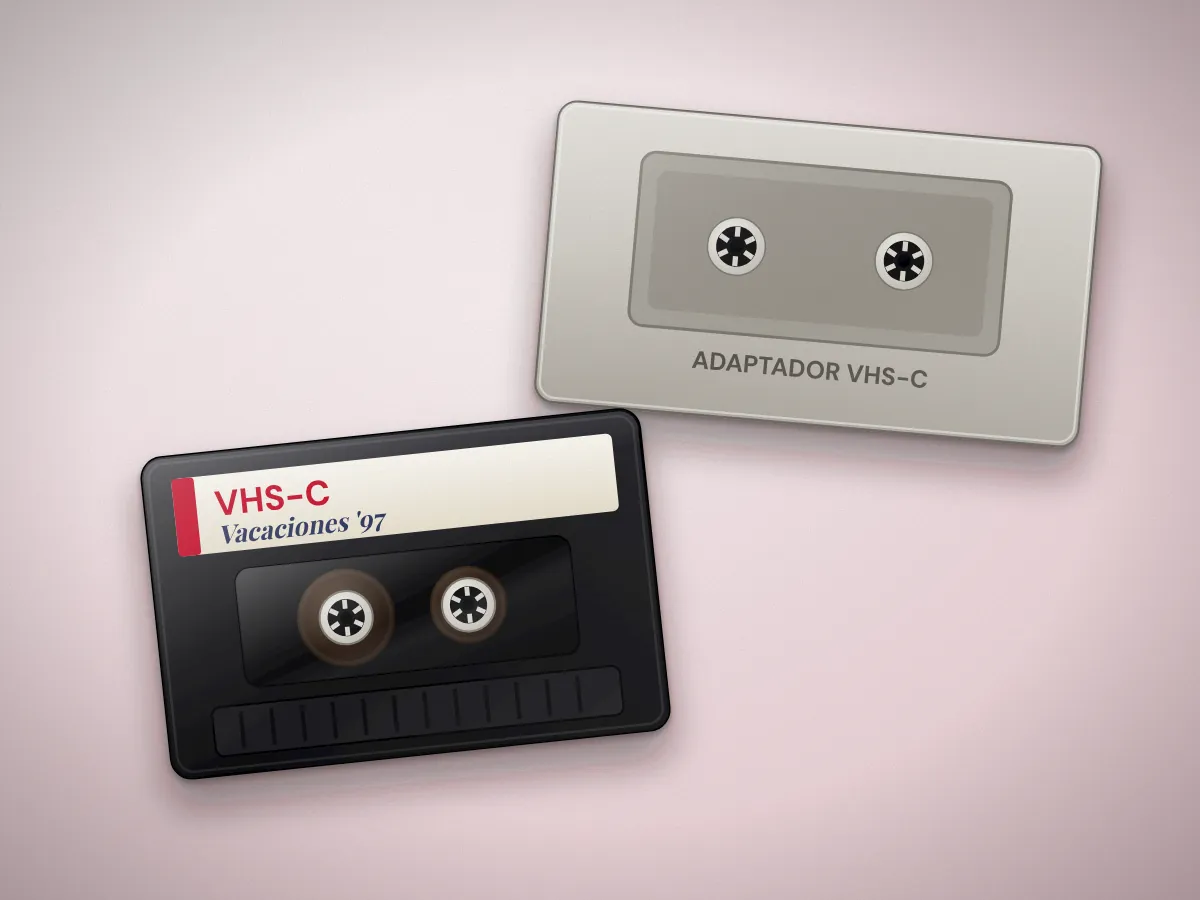 Cinta VHS-C compacta junto a su adaptador para reproducirla